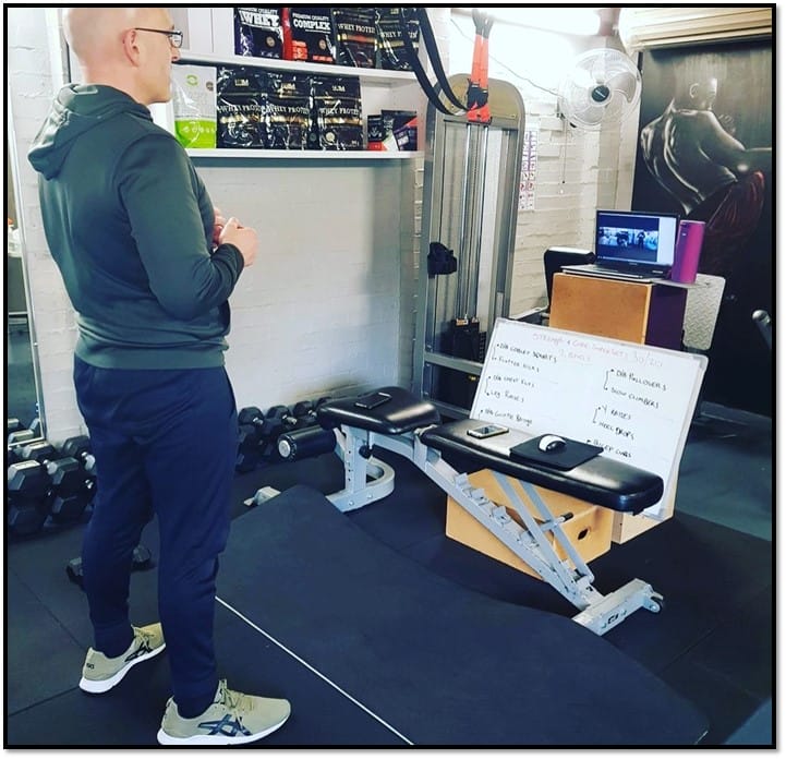 Personal trainer conducting online workout session